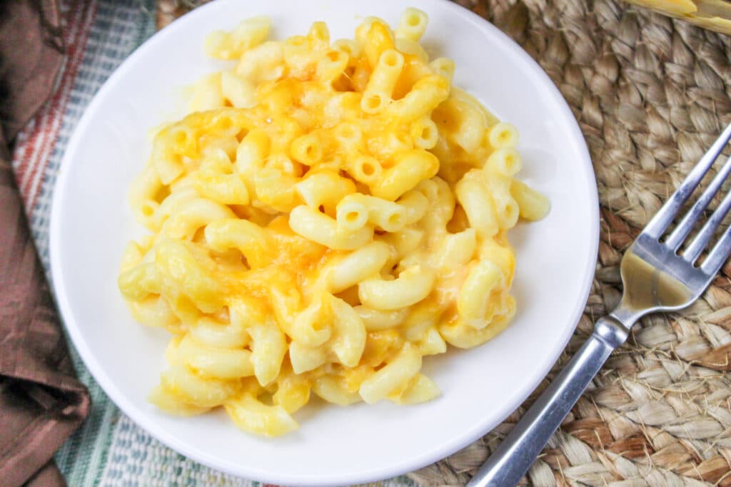 close up of copycat chick fil a mac and cheese on a white plate