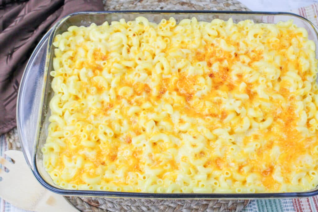 finished copycat chick fil a mac and cheese in a glass baking dish