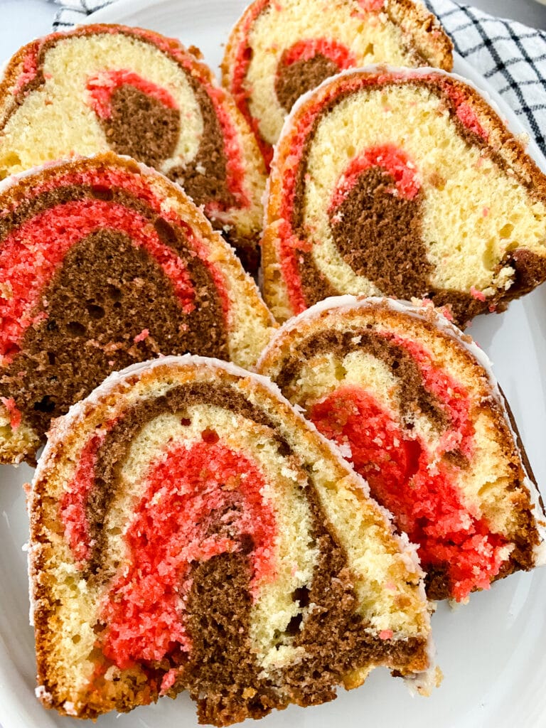 close up of slices of Neapolitan Bundt cake on a white plate