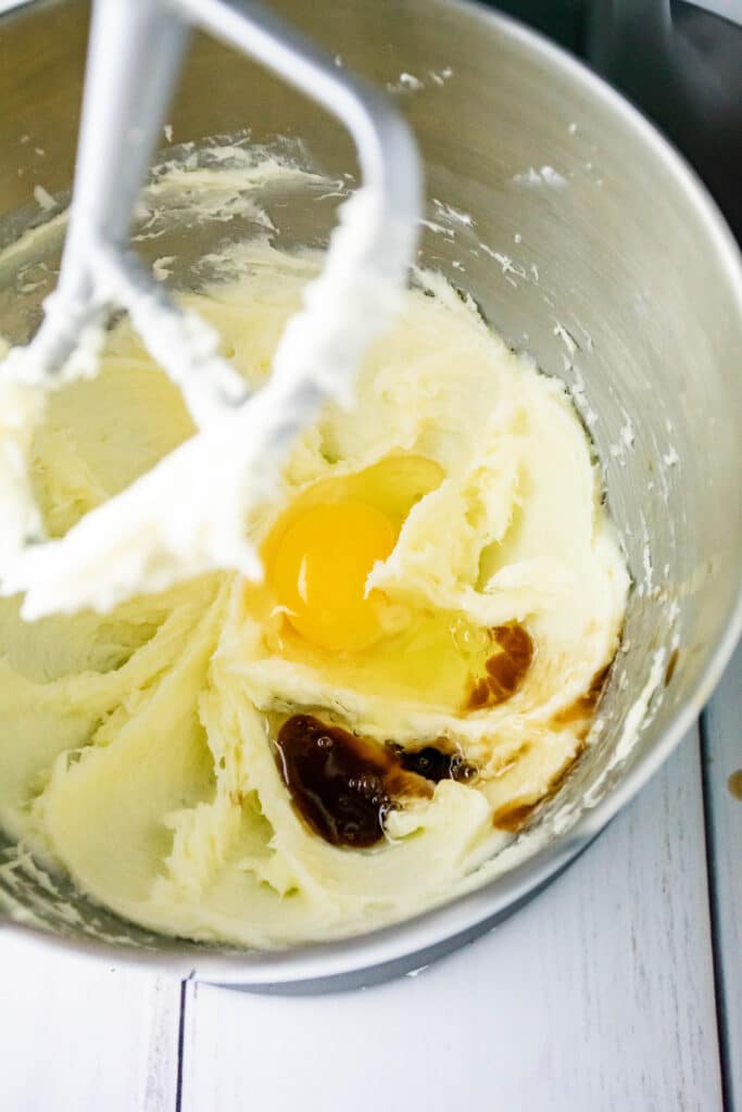 eggs added to butter and sugar in a mixing bowl