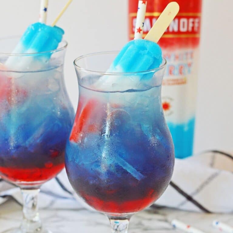 two glasses of bomb pop cocktail on a marble counter