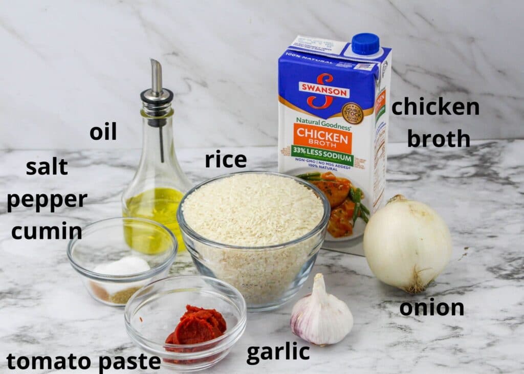 ingredients for instant pot mexican rice on a marble counter labelled with text