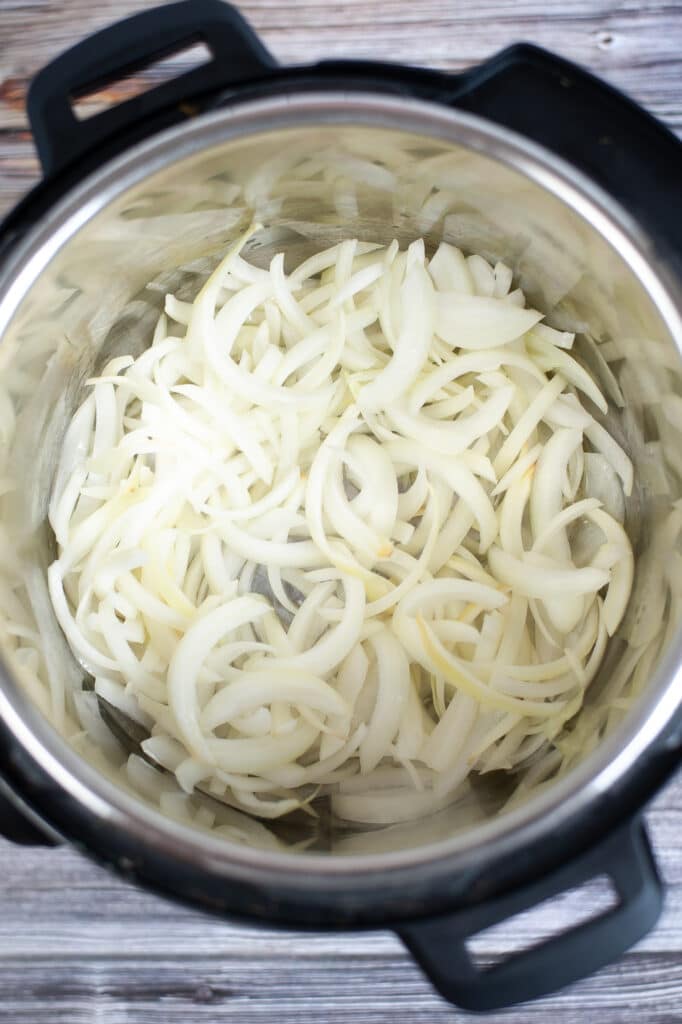 onions and olive oil in a pressure cooker
