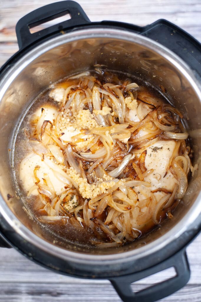 chicken breasts, onions, garlic and beef broth in the pessure cooker