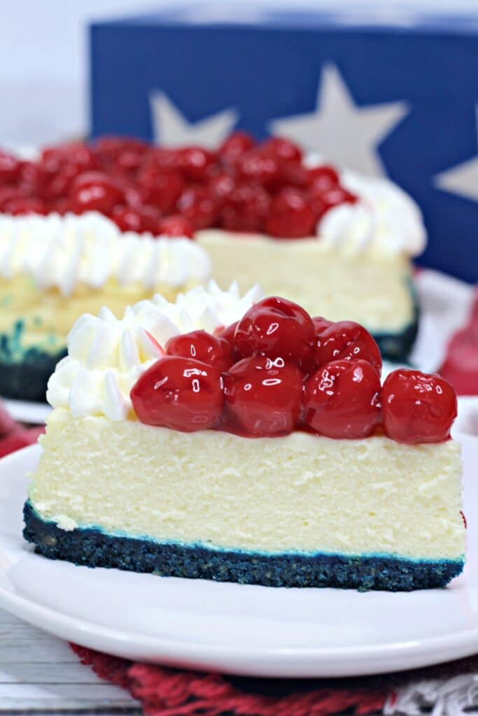 slice of patriotic cheesecake on a white plate