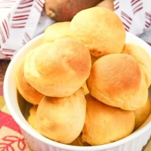close up of sweet potato rolls in a white bowl