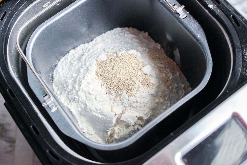 yeast on top of ingredients in a bread machine