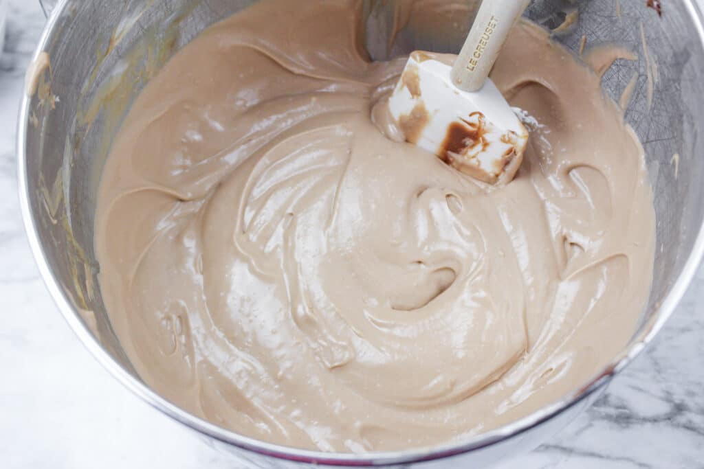 nutella cheesecake batter in a stainless steel mixing bowl