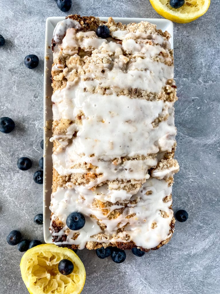 full loaf of blueberry nut bread in a white loaf pan