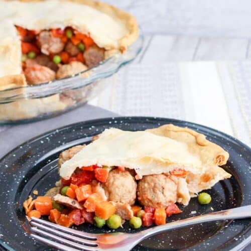 slice of meatball pot pie on a black and white plate