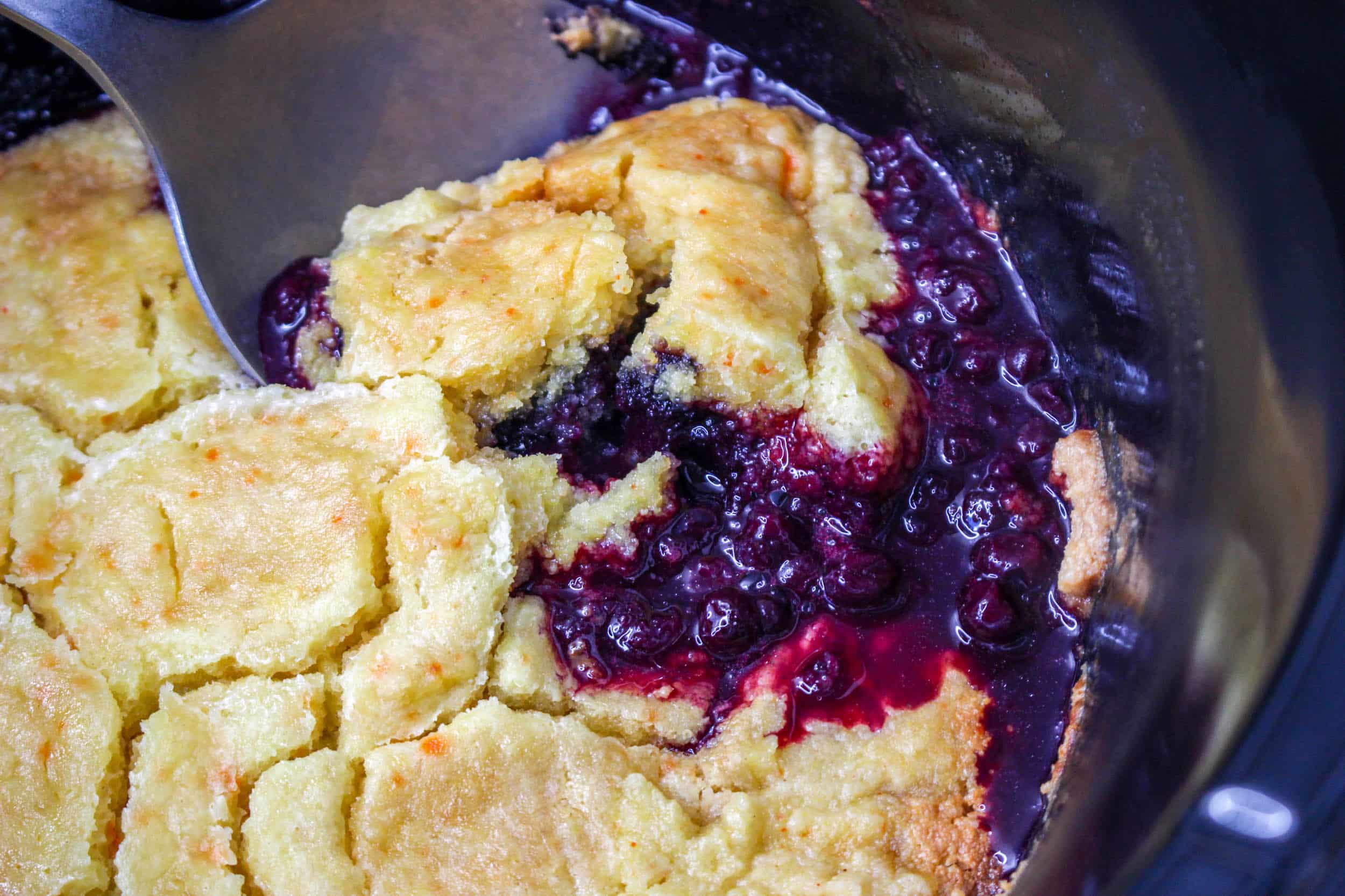 close up of cooked slow cooker blueberry cobber