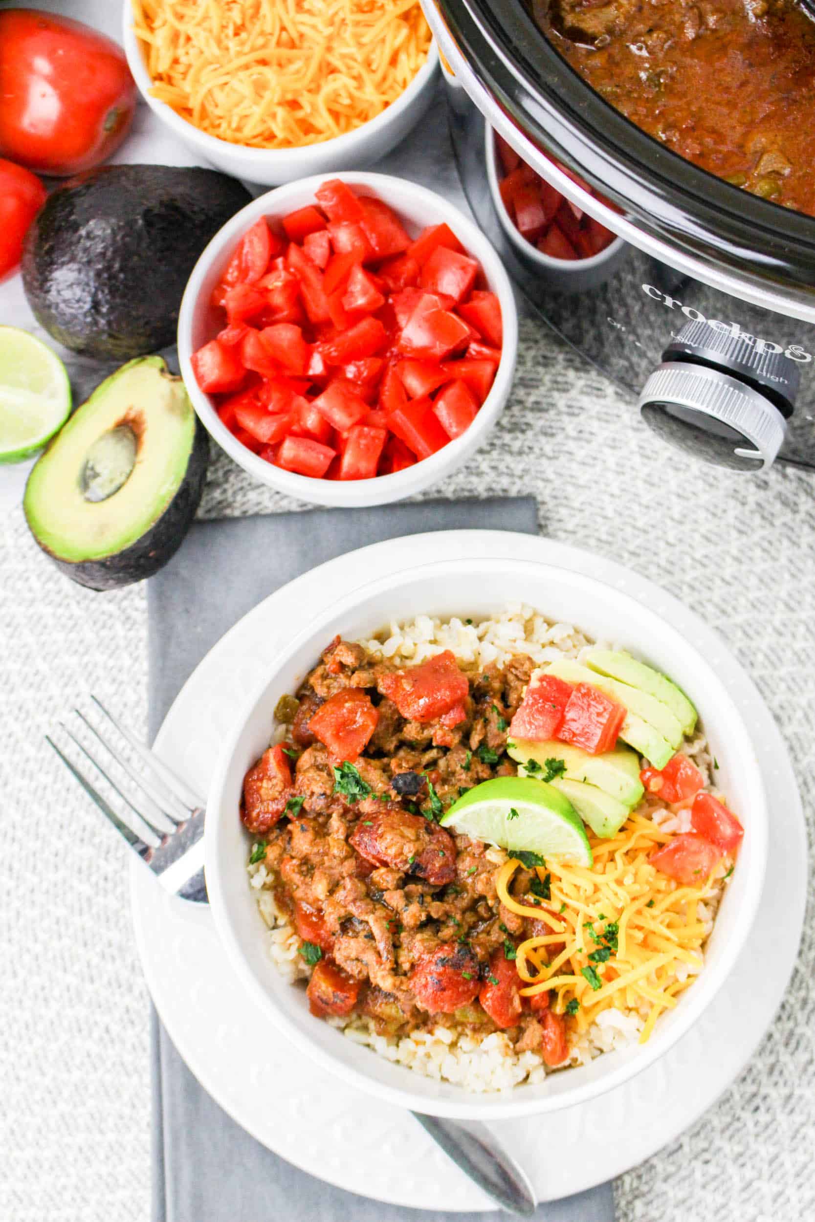 birds eye image of Slow Cooker Carne Picada in a white bowl filled with rice