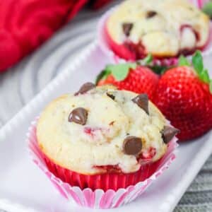 strawberry chocolate chip muffins on a white plate