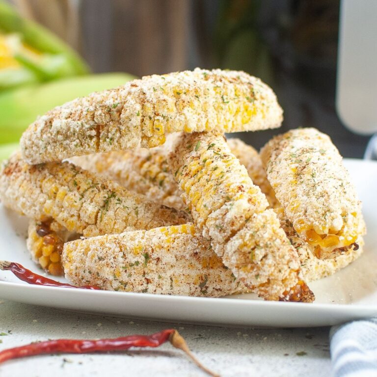 stack of air fryer corn ribs on a white plate