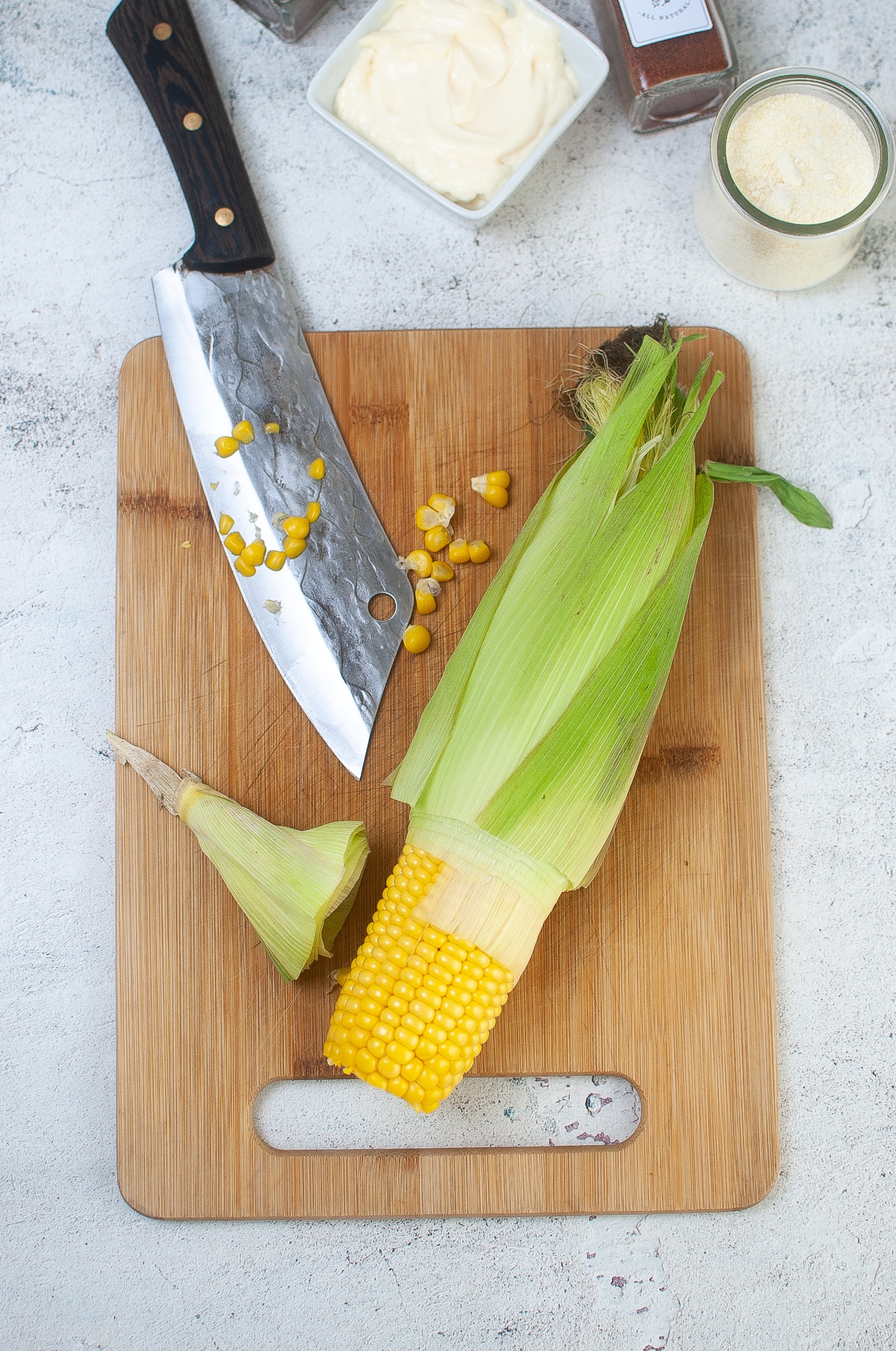 corn being removed from the shuck