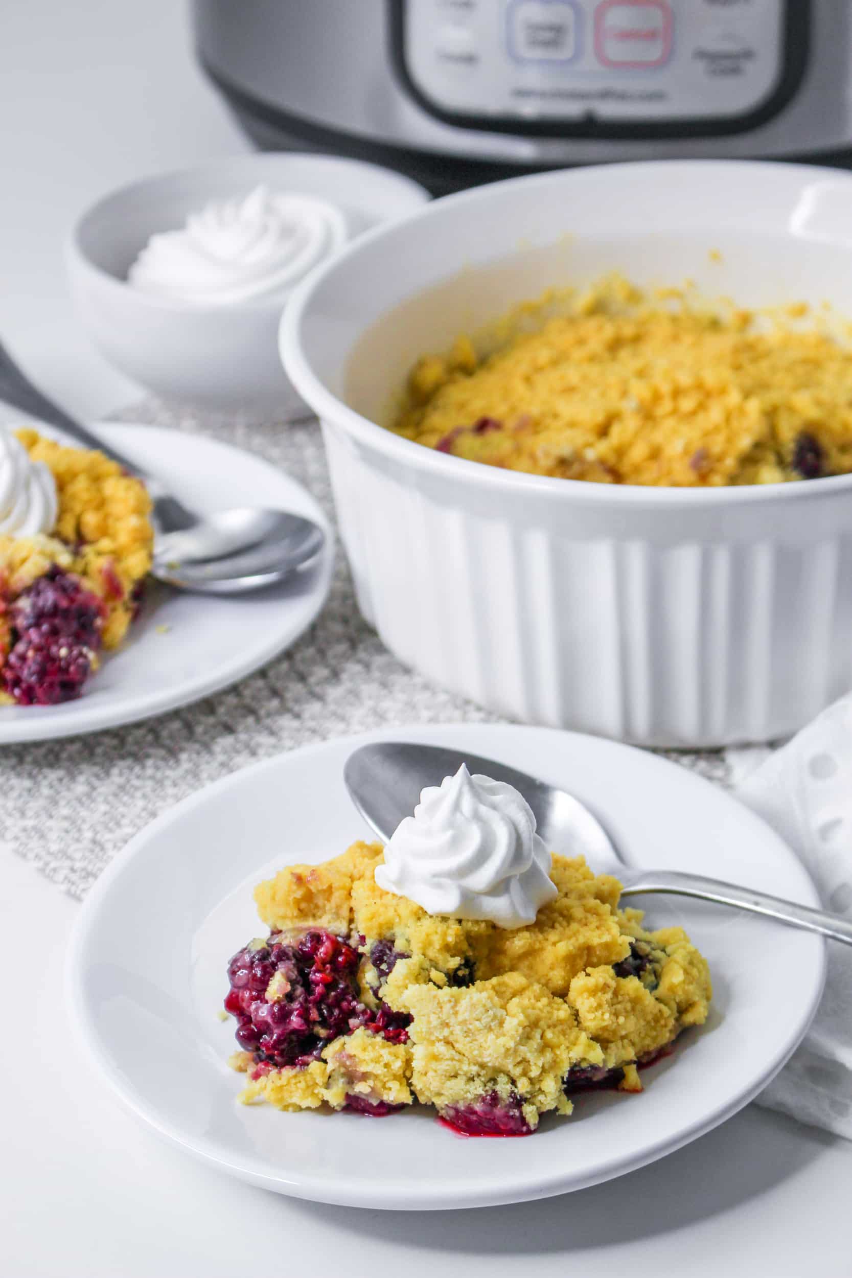 image of a instant pot blackberry cobbler on a white plate