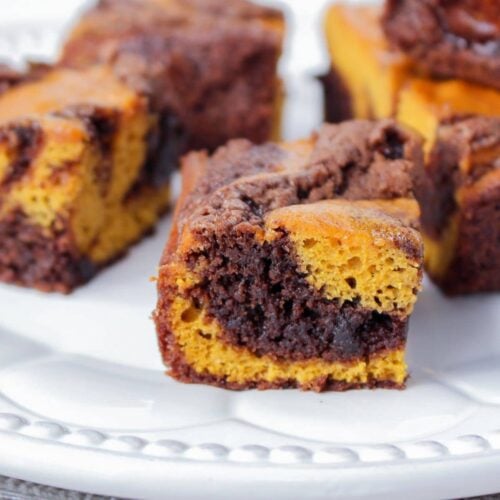 pumpkin brownies on a white plate