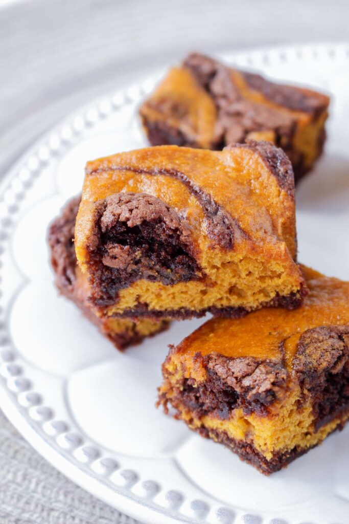 pumpkin brownies on a white plate