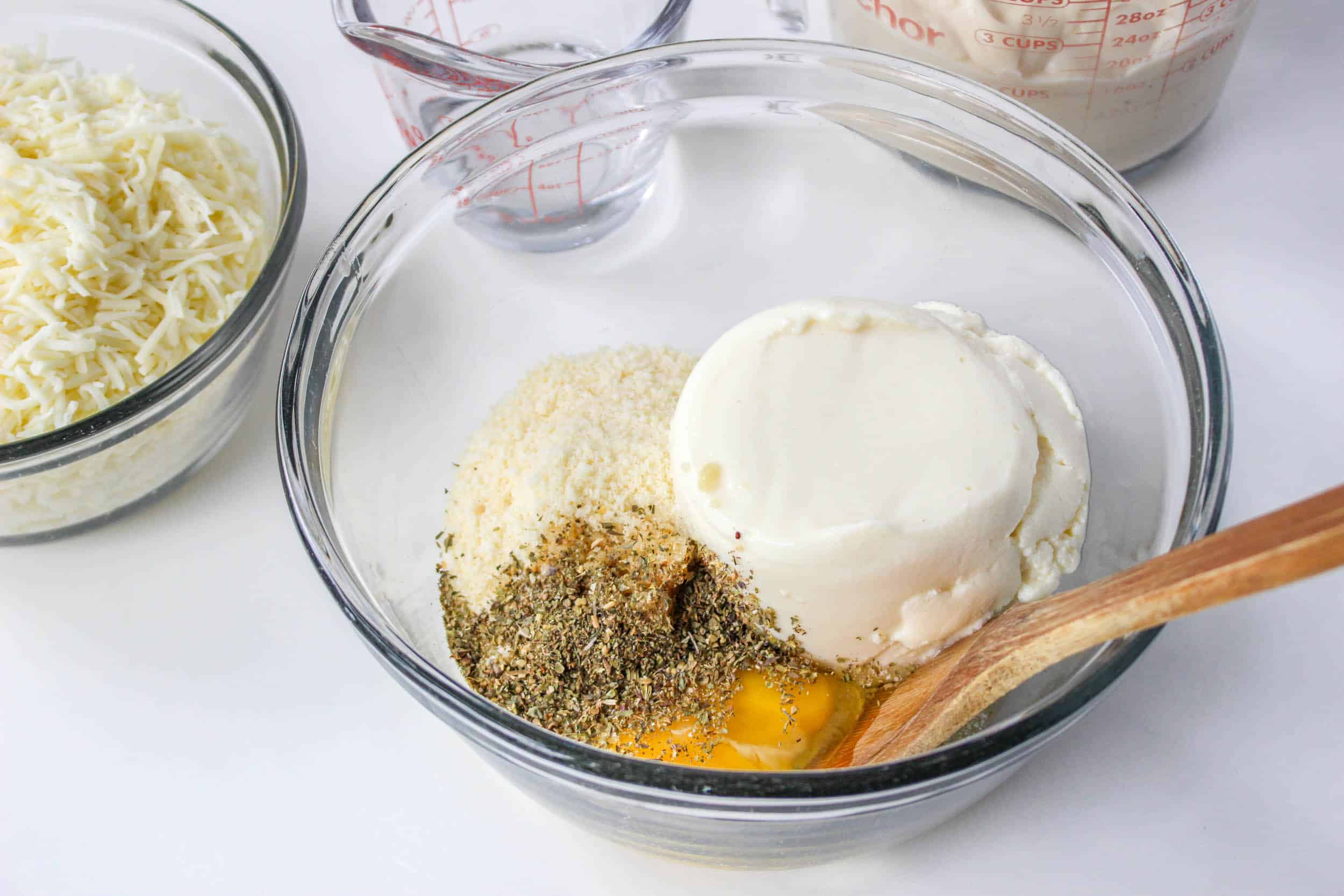 ricotta, parmesan cheese, egg, and italian seasoning in a small bowl