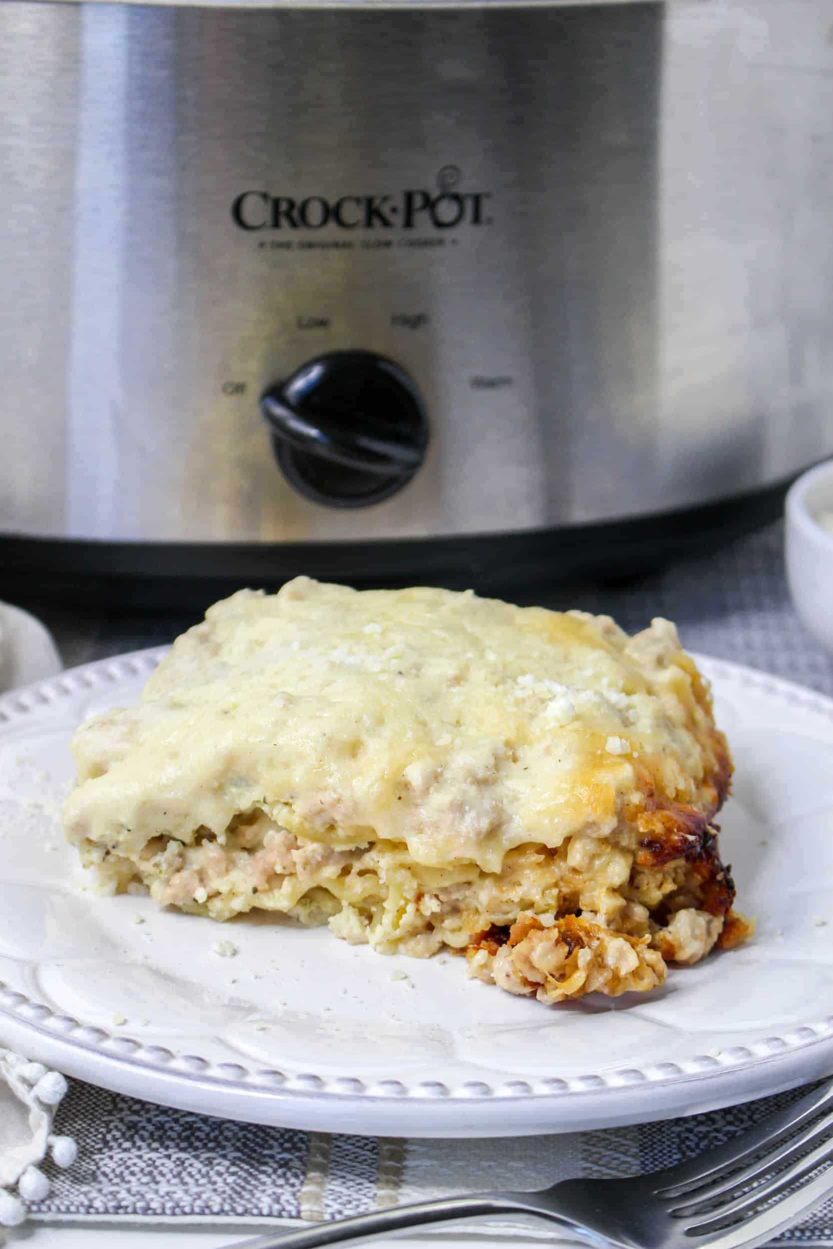 slice of slow cooker white lasagna on a white plate
