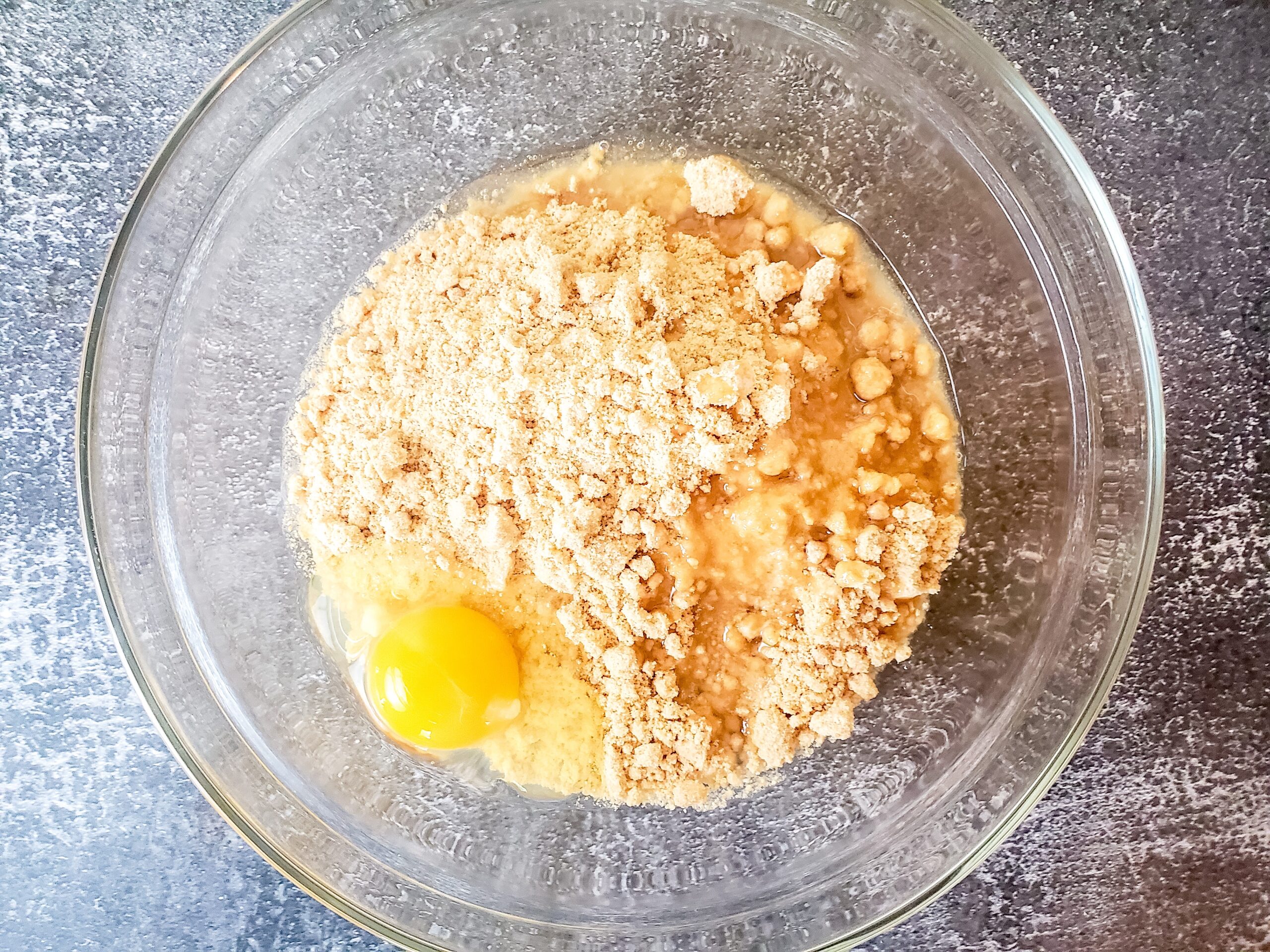 cookie mix, oil, egg and water in a glass mixing bowl