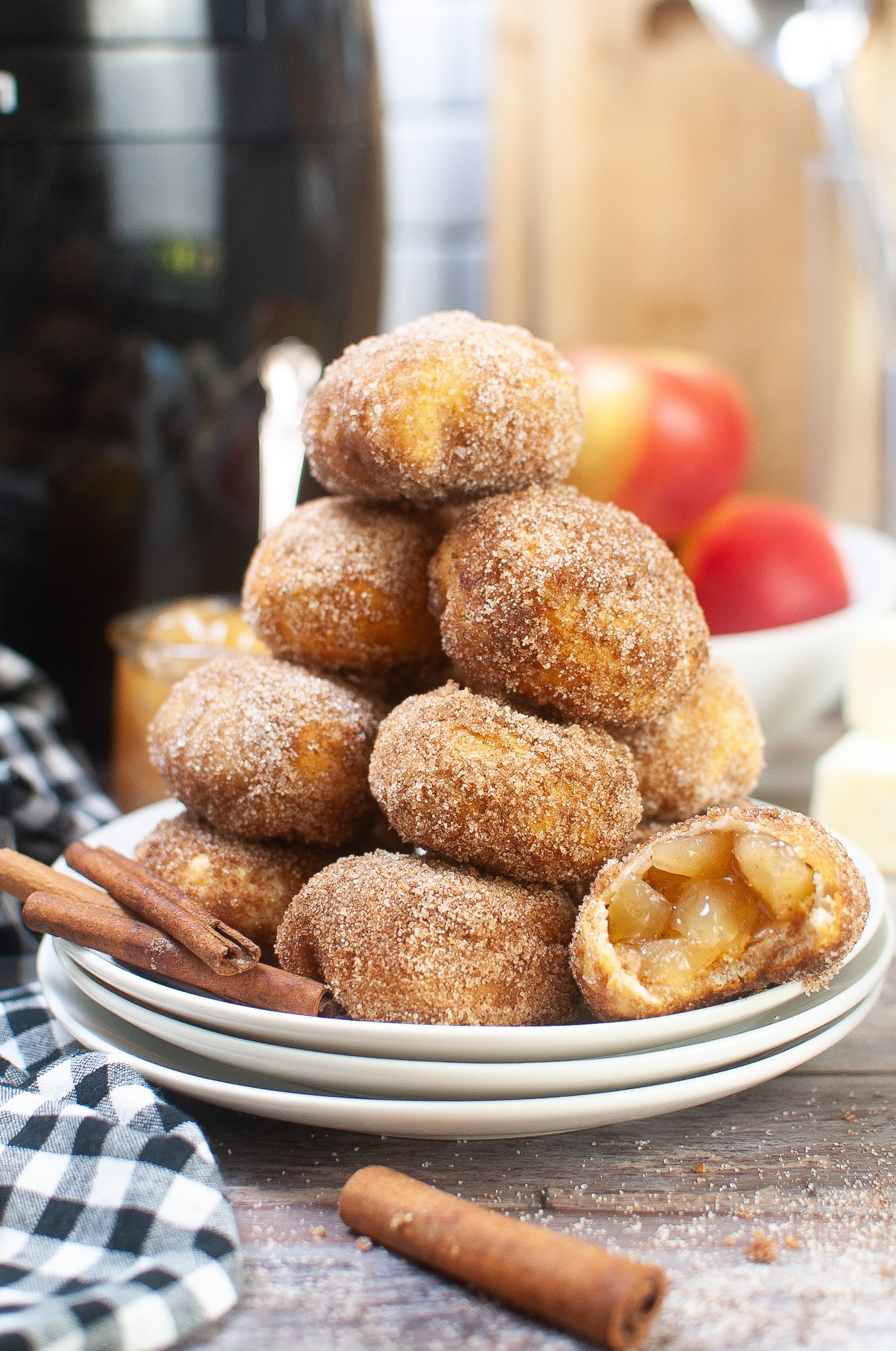 stack of air fryer apple bombs with one bitten in half