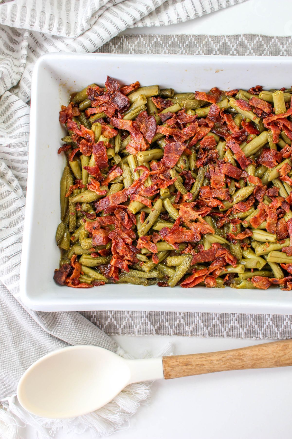 off center image of a casserole dish filled with crack green beans