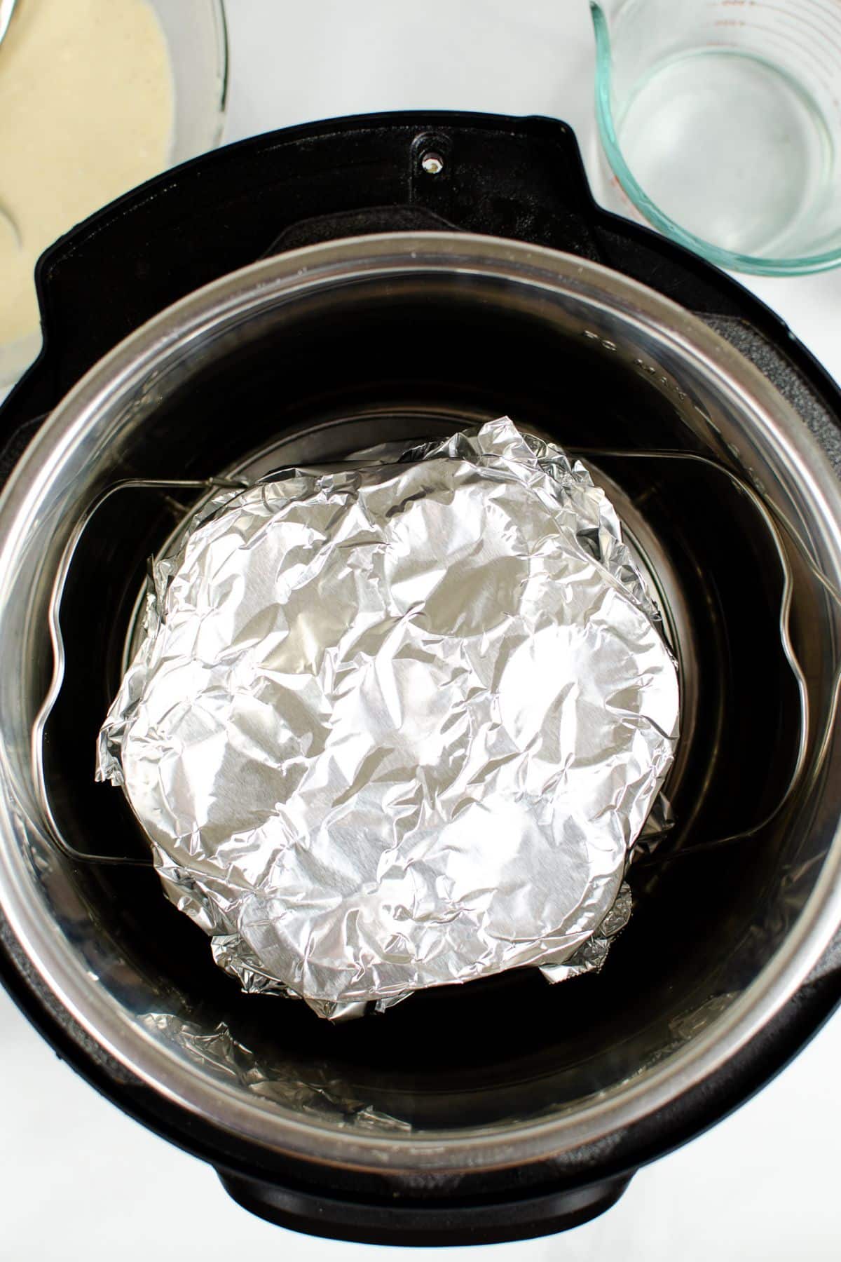 foil covered egg bite molds in a pressure cooker