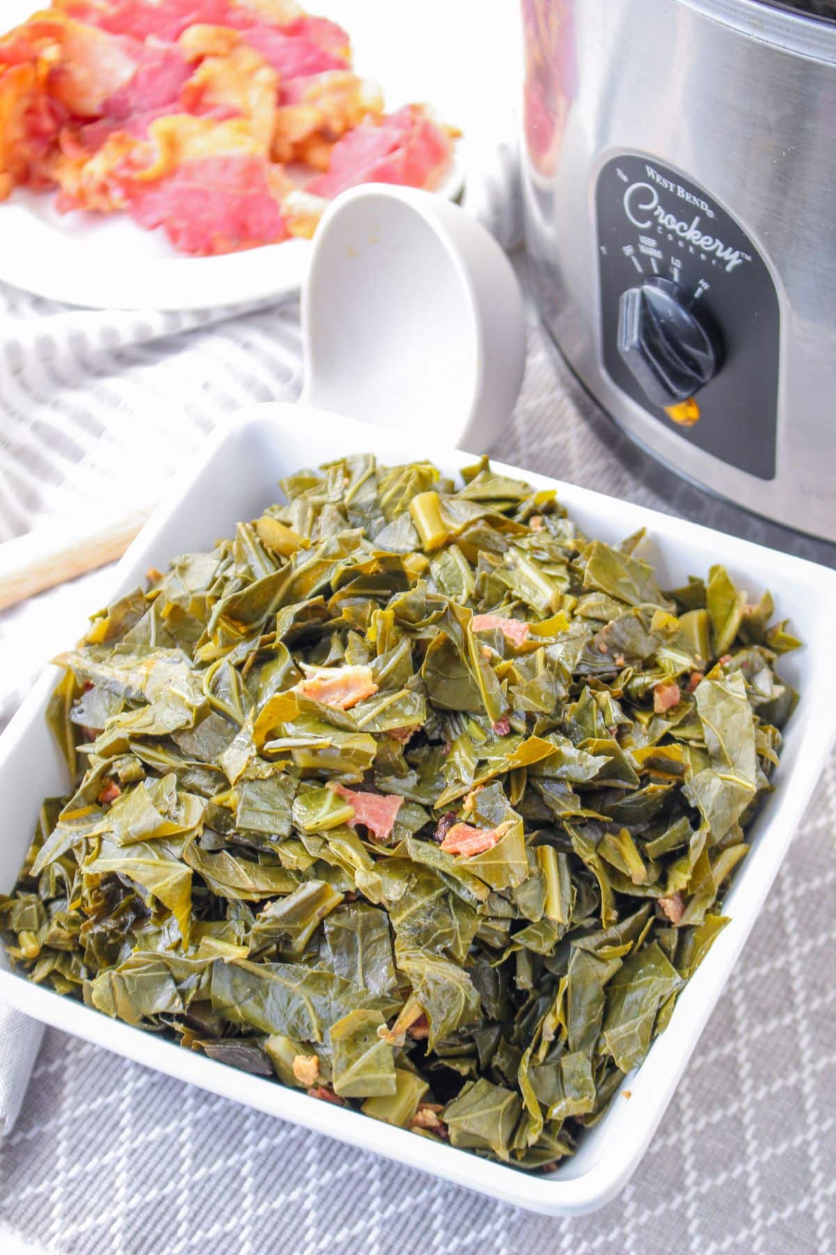 white bowl filled with slow cooker collard greens