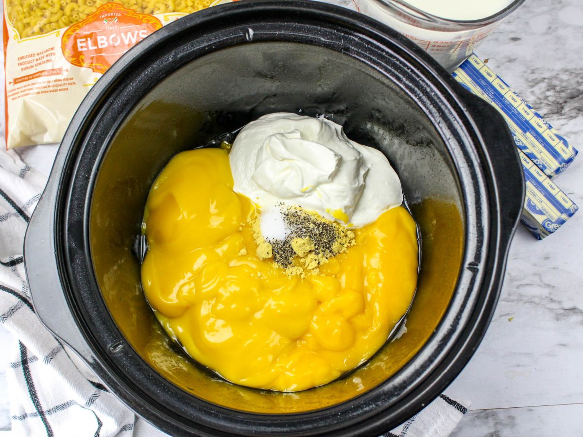cheese soup, sour cream, salt, pepper, and ground mustrad in a crock pot liner