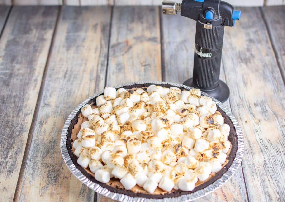 chocolate pie topped with marshmallows that have been toasted