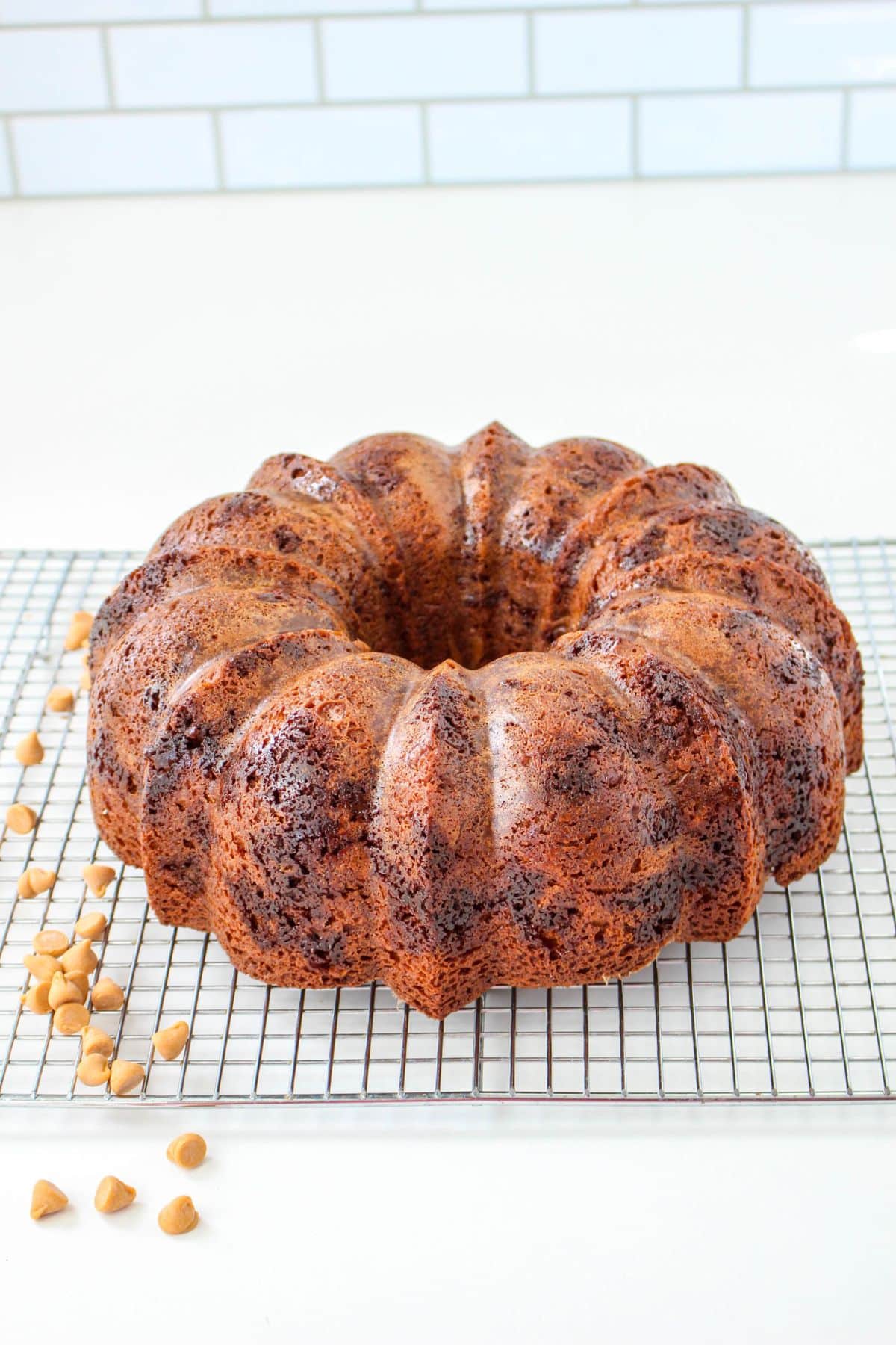 uncut butterscotch bundt cake on a cooling rack