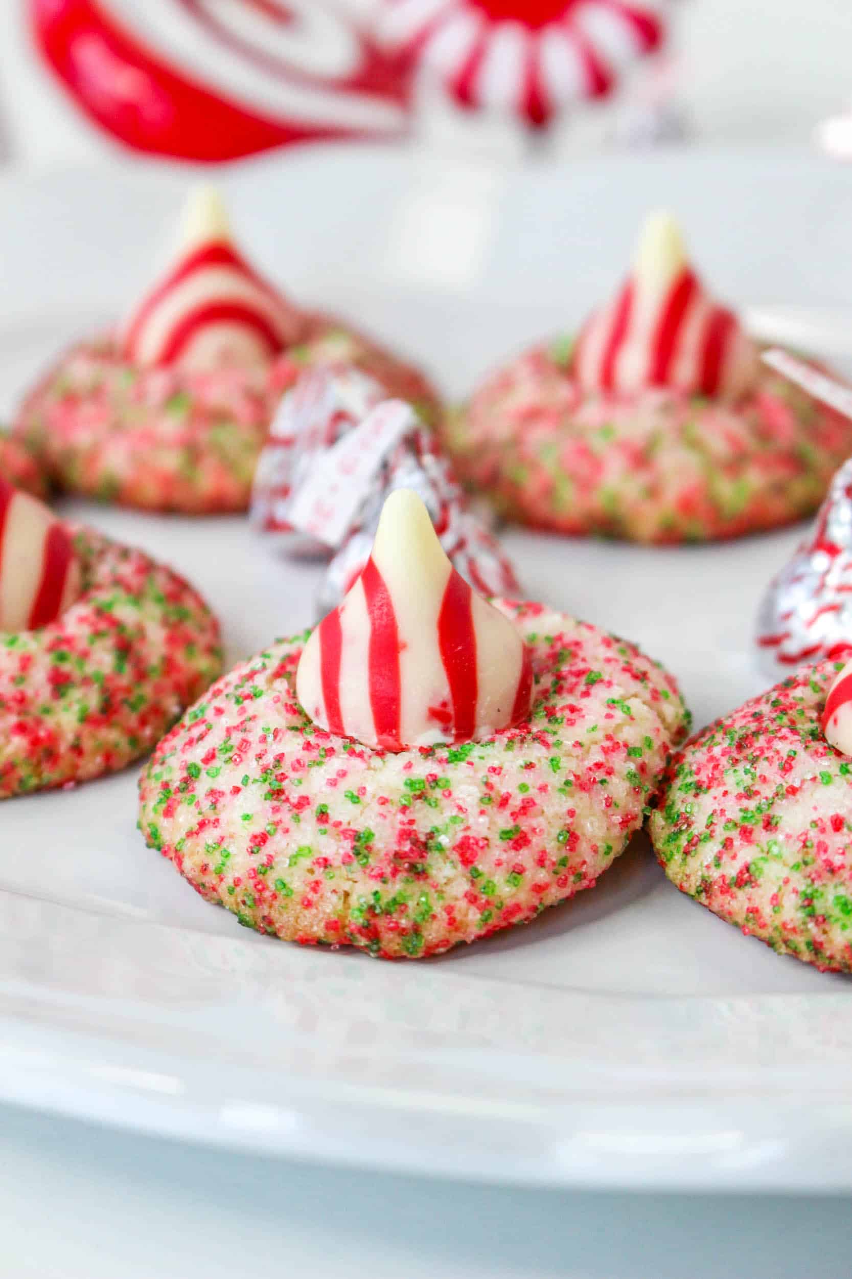 close up of candy cane shortbread cookies on a white plate