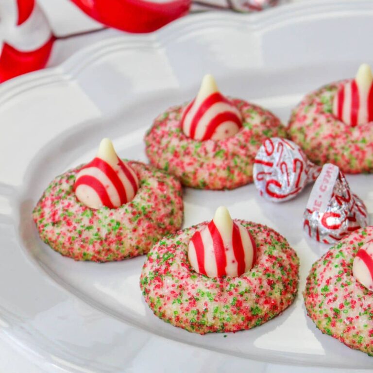 candy cane shortbread cookies on white plte wtih candy cane kisses
