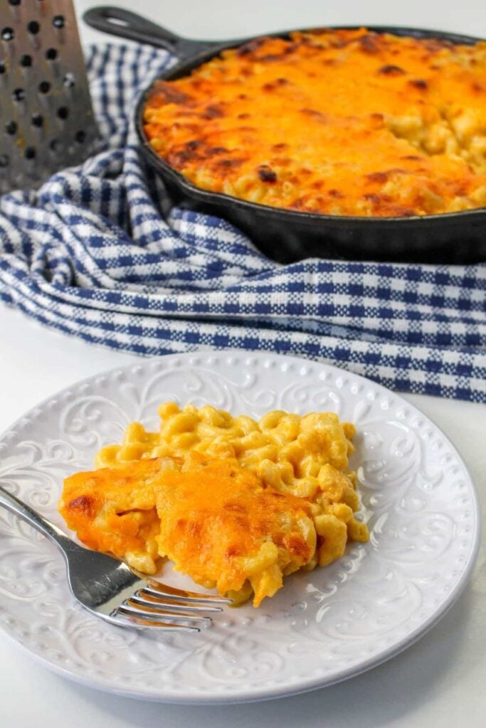 white plate with a scoop of mac and cheese on it