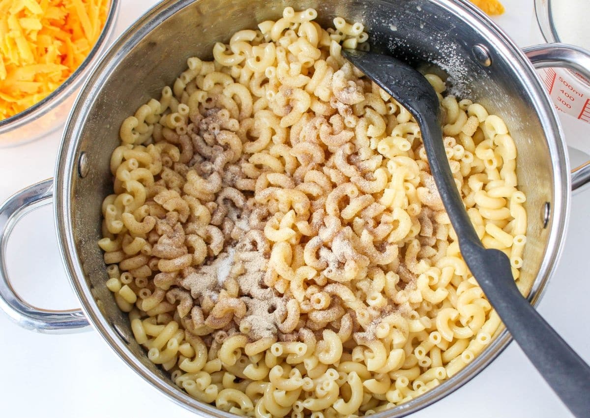 cooked elbow noodles and salt and pepper in a large pot