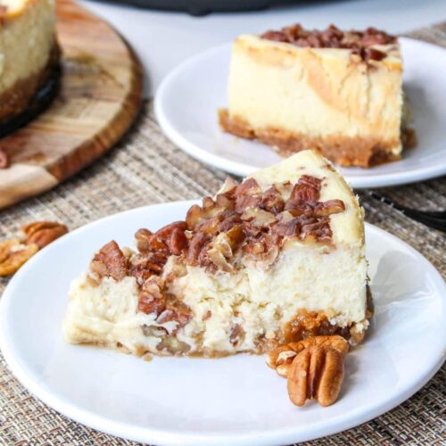 slice of pecan pie cheesecake on a white plate