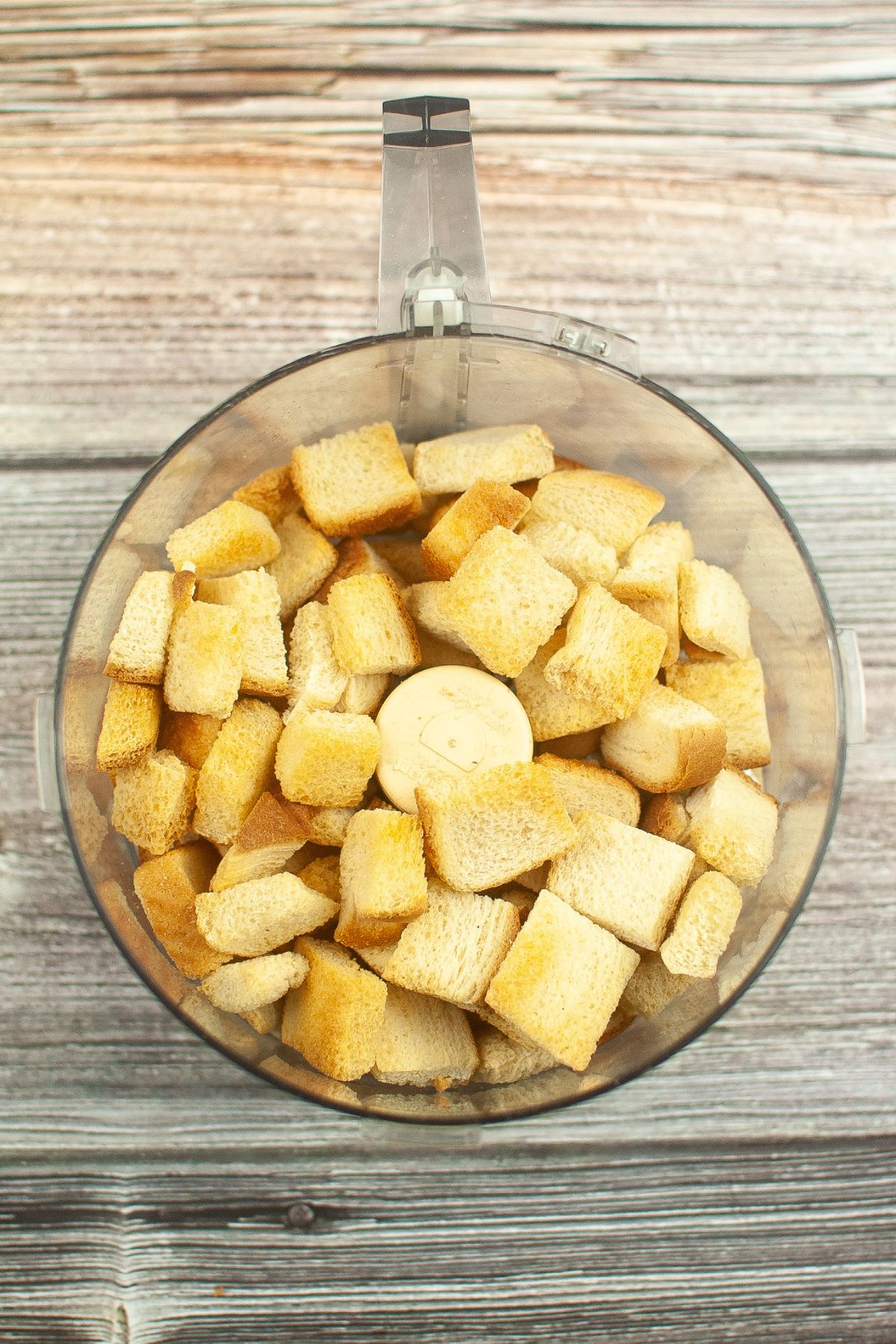 toasted bread cubes in a food processer