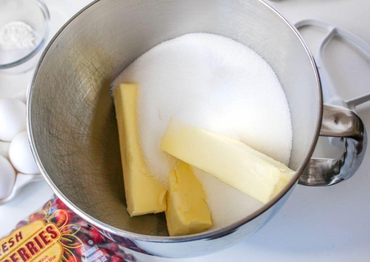 butter and sugar in a stainless steel stand mixer