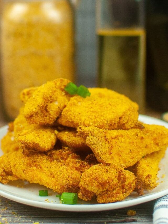 stack of shake and bake chicken tenders on a white plate