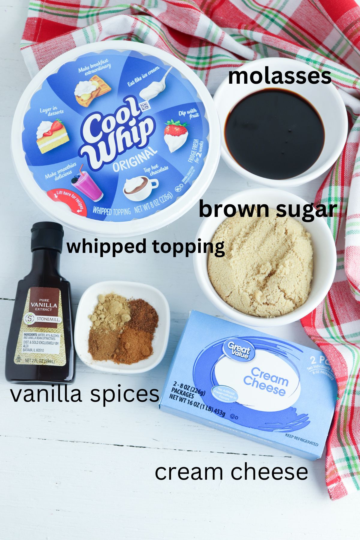 whipped topping, molasses, brown sugar, cream cheese, vanilla extract, and spices on a white background