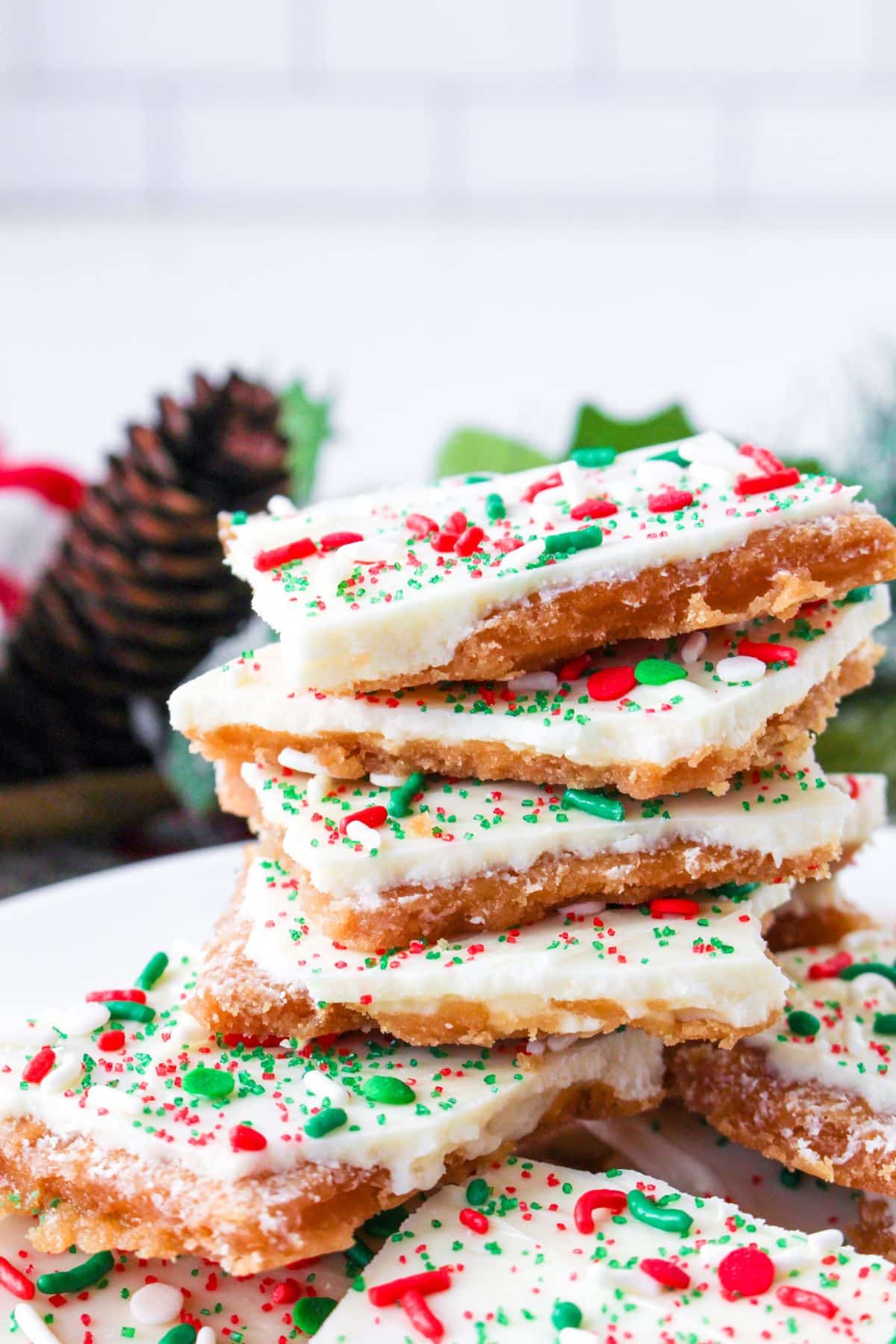 stack of white chocolate christmas crack on a white plate