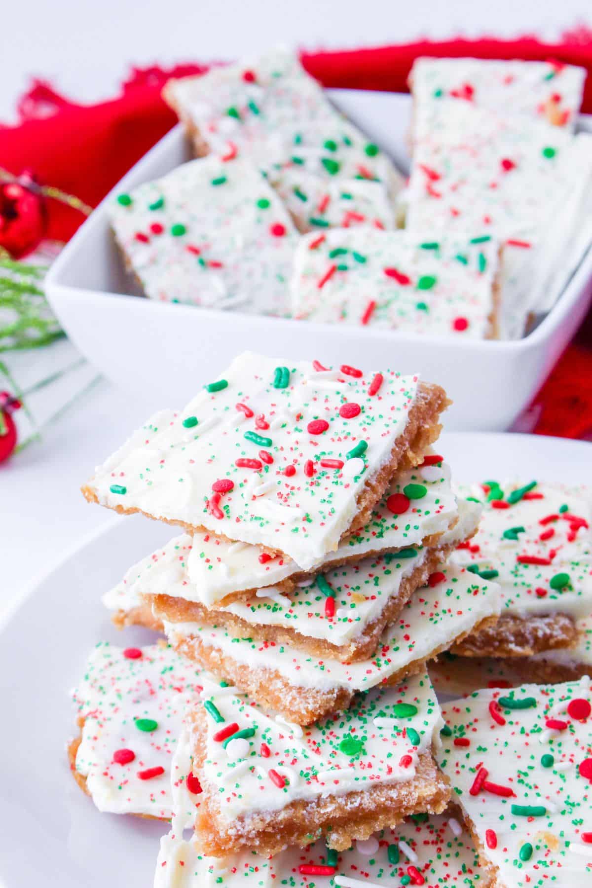 stack of white chocolate christmas crack on a white plate