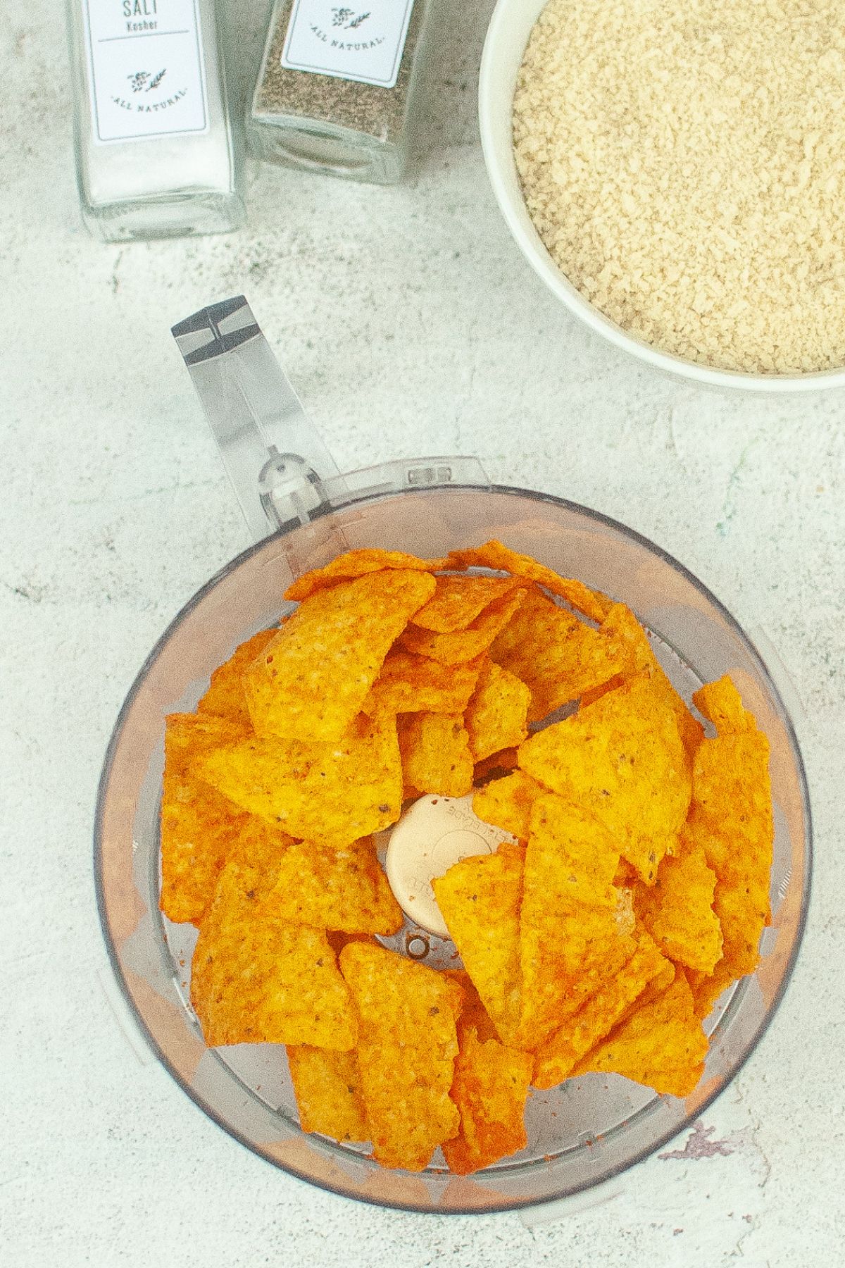 chips in the bowl of a food processor