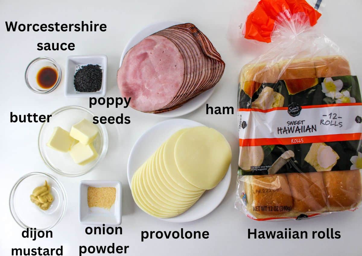 hawaiian rolls, ham, provolone, poppy seeds, onion powder, dijon mustard, butter, worcestershire sauce on a white background