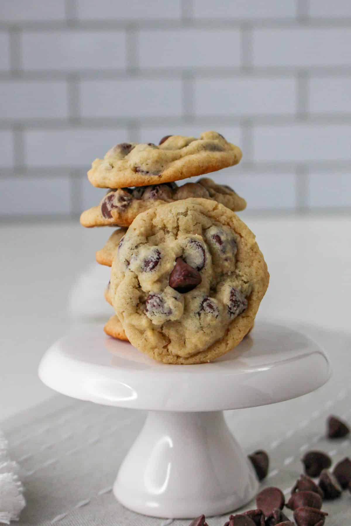six yogurt chocolate chip cookies on a white cupcake stand