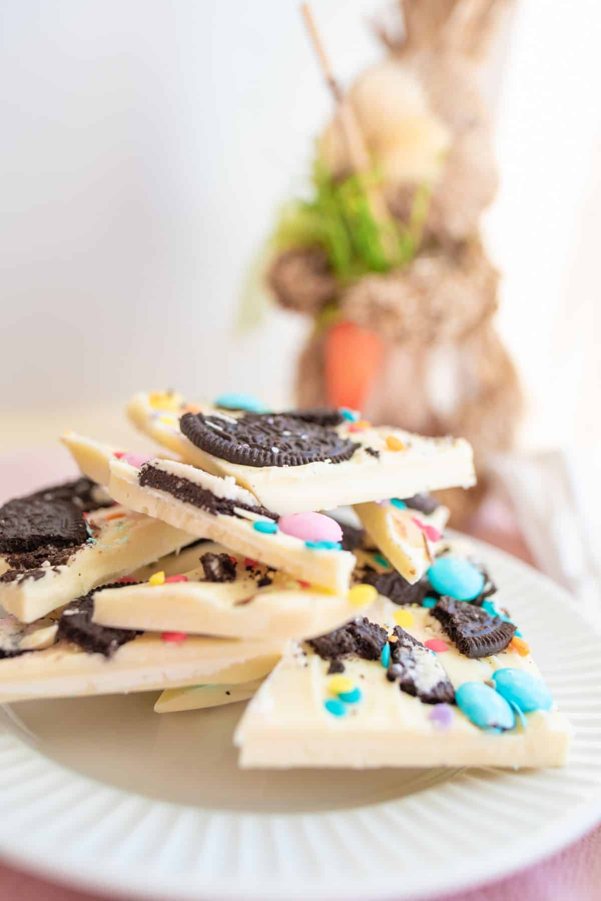 side angle view of pieces of oreo bark on a white plate