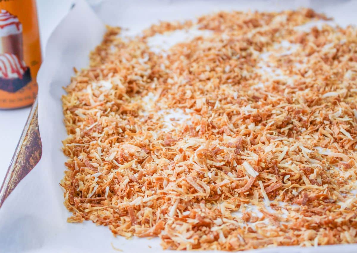 toasted coconut on a parchment lined baking sheet