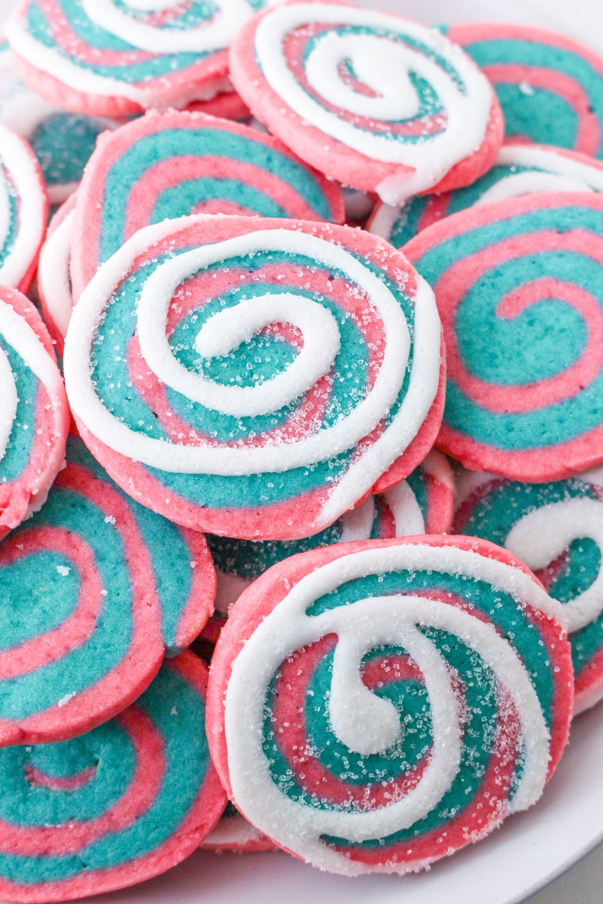 stack of cotton candy cookies on a white platter