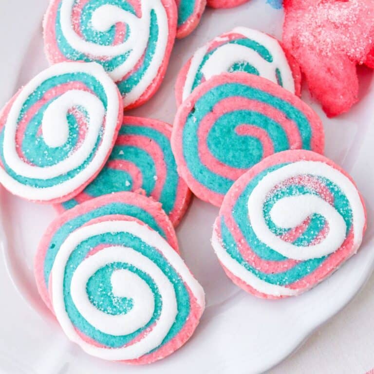 cotton candy cookies on a white plate